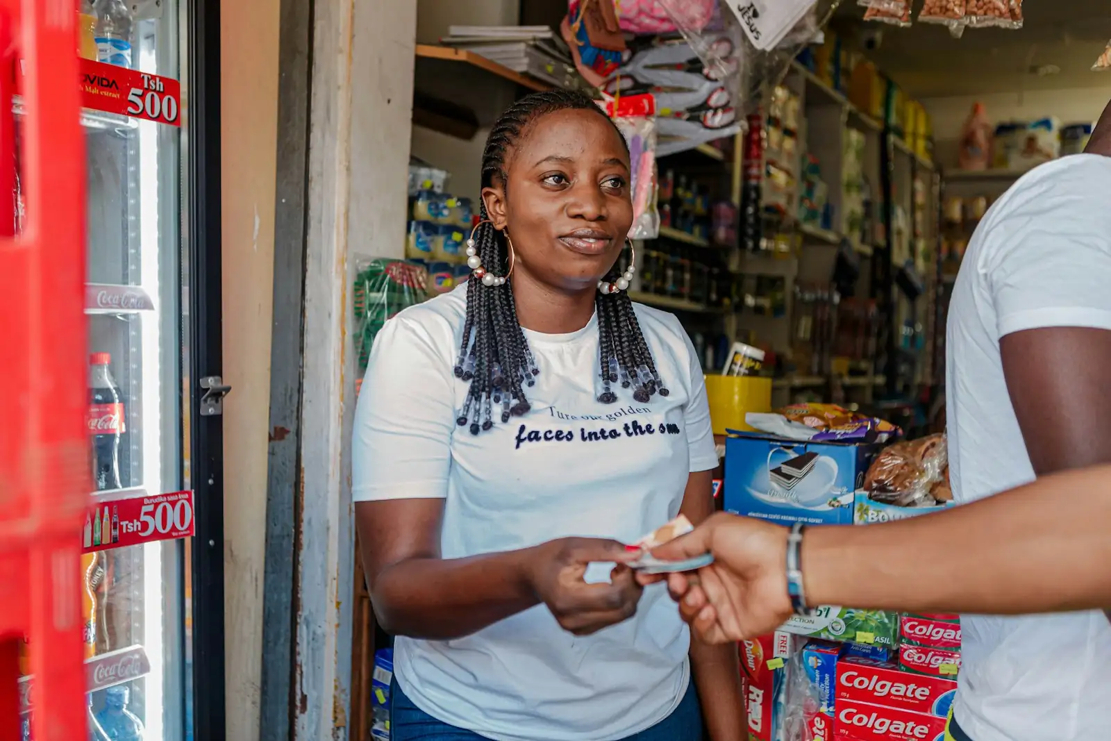 A woman running her own shop, serving a customer
